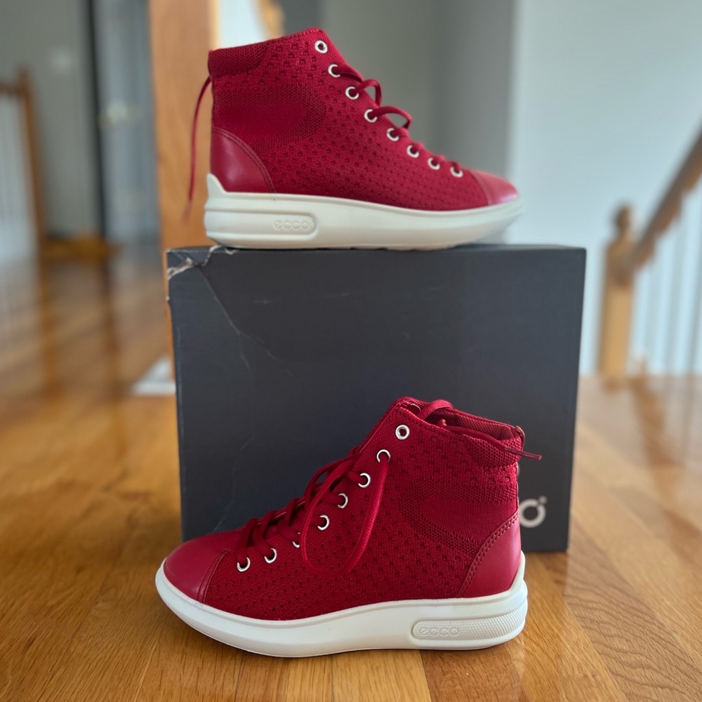 Ecco sneakers that are red and white.